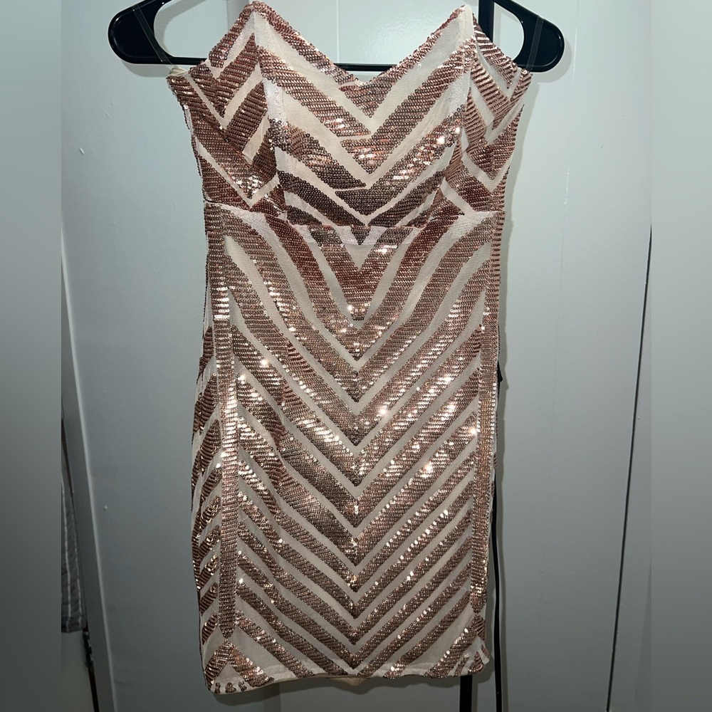 Body con dress. Strapless. Gold sequin, champagne color. Never been worn.